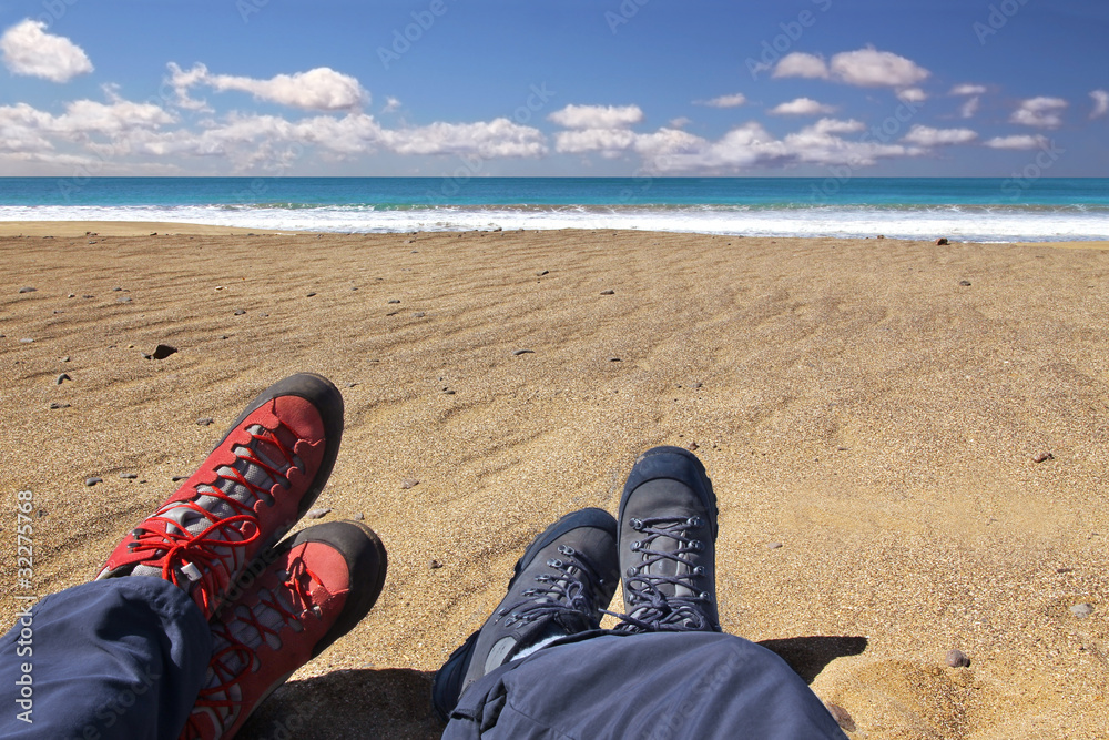 Fototapeta premium Relaxing on the beach after a long hiking tour