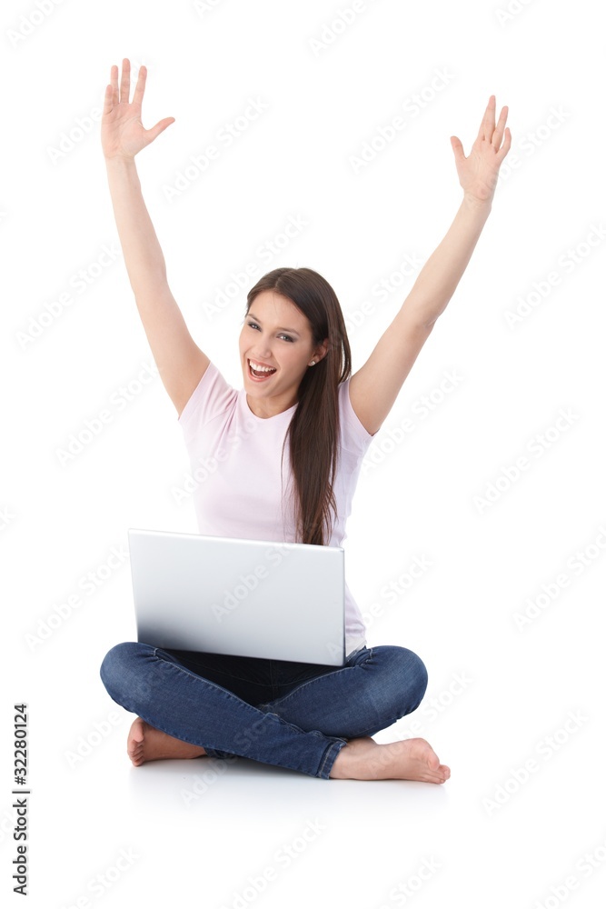 Happy girl with laptop hands up Happy girl with laptop hands up