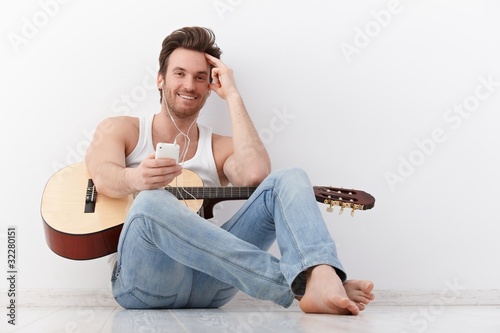 Happy guitarist with headset