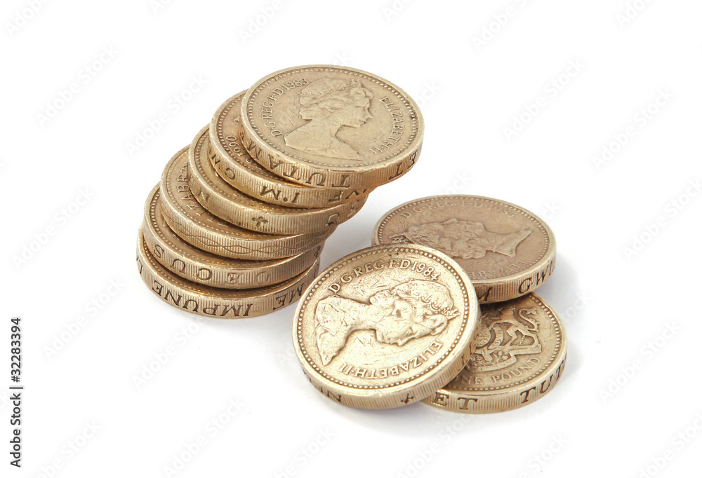 British, UK, pound coins on a plain white background. British, UK, pound coins on a plain white background.