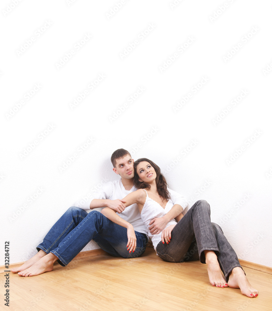A young and loving Caucasian couple in stylish jeans A young and loving Caucasian couple in stylish jeans