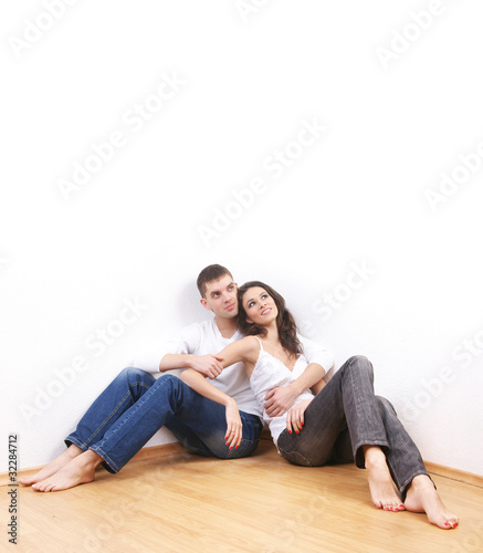 A young and loving Caucasian couple in stylish jeans