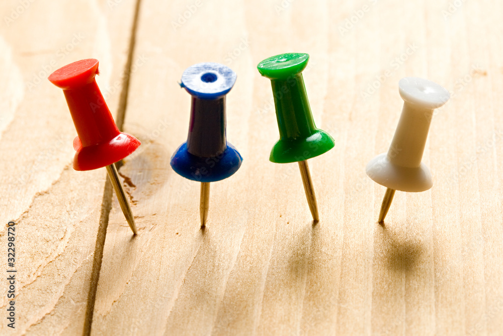 Pins on the wooden background Pins on the wooden background