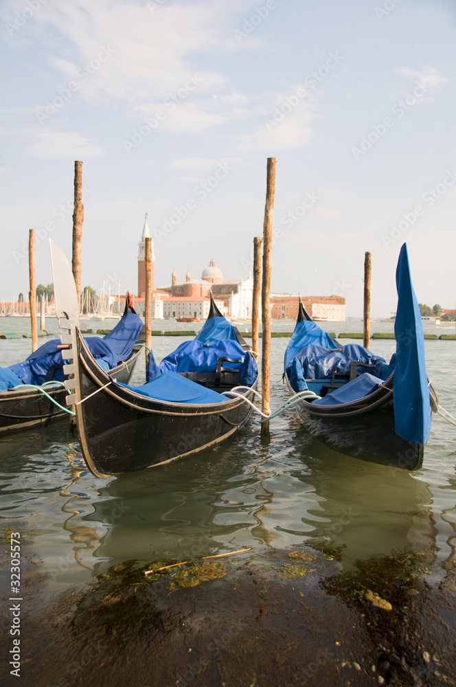 gondolas in Grand Canal Venice Italy famous church in background