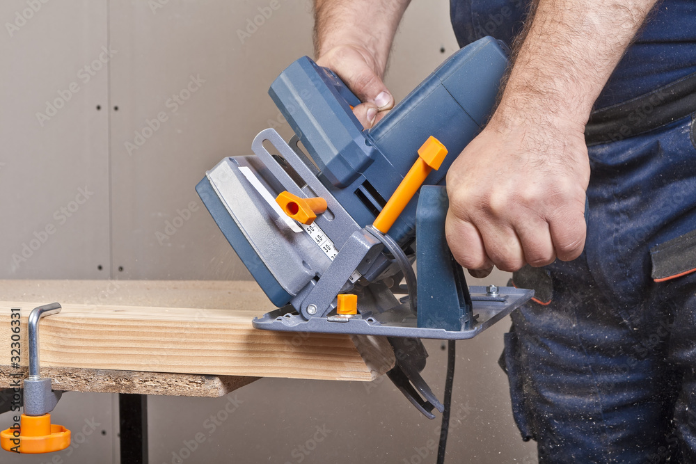 Carpenter with circular saw Carpenter with circular saw