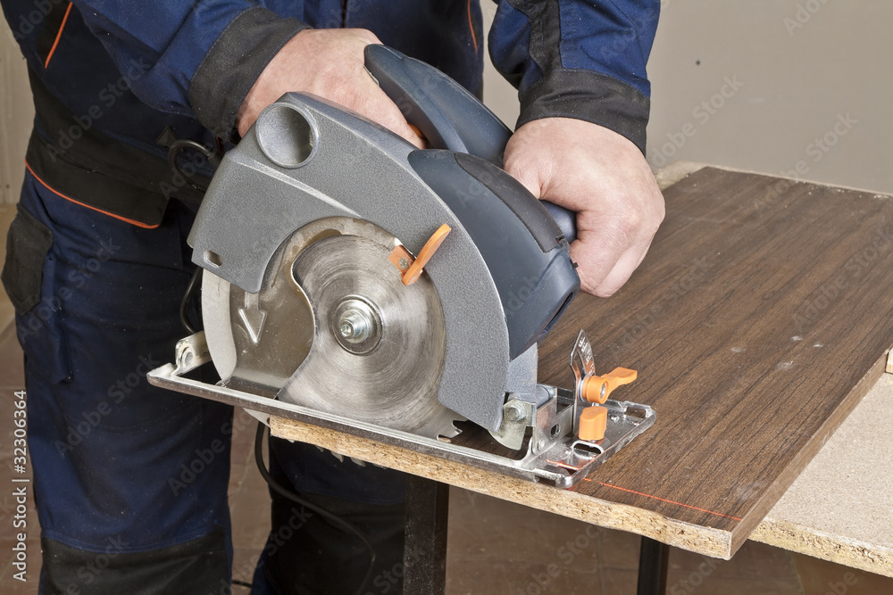 Carpenter with circular saw Carpenter with circular saw