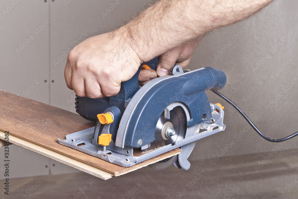 Carpenter with circular saw Carpenter with circular saw