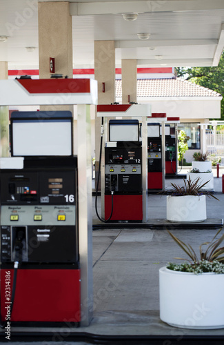 four gas pump islands at station no cars