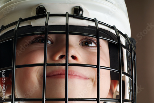 Boy in hockey helmet photo