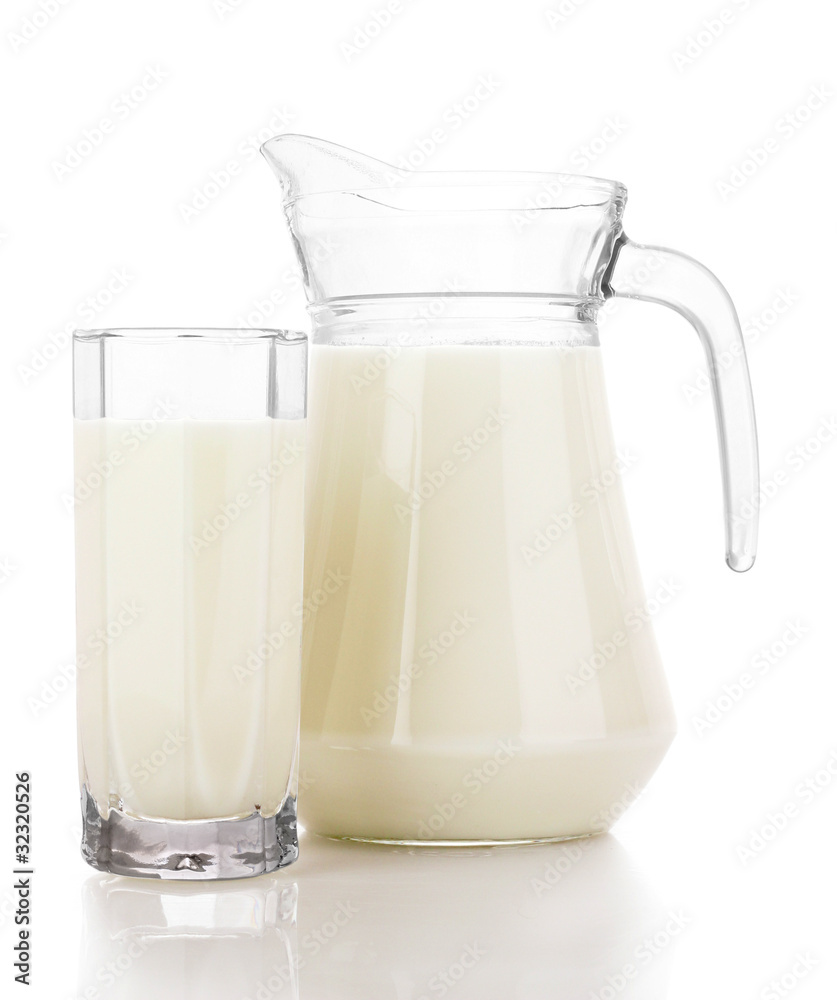 Pitcher and Glass with milk isolated on white Pitcher and Glass with milk isolated on white
