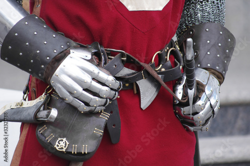 Gloves and weapons of a knight photo