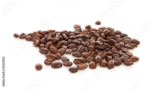 Pile of roasted coffee beans over white background
