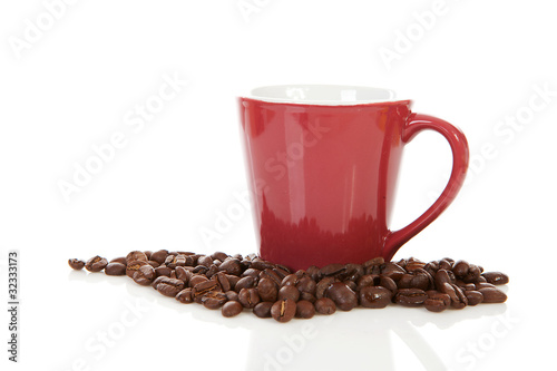 coffee cup and beans over white background