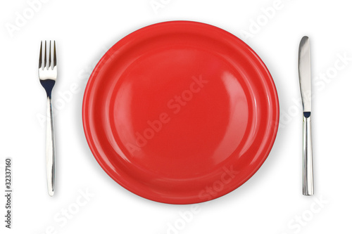 Knife, red plate and fork i...