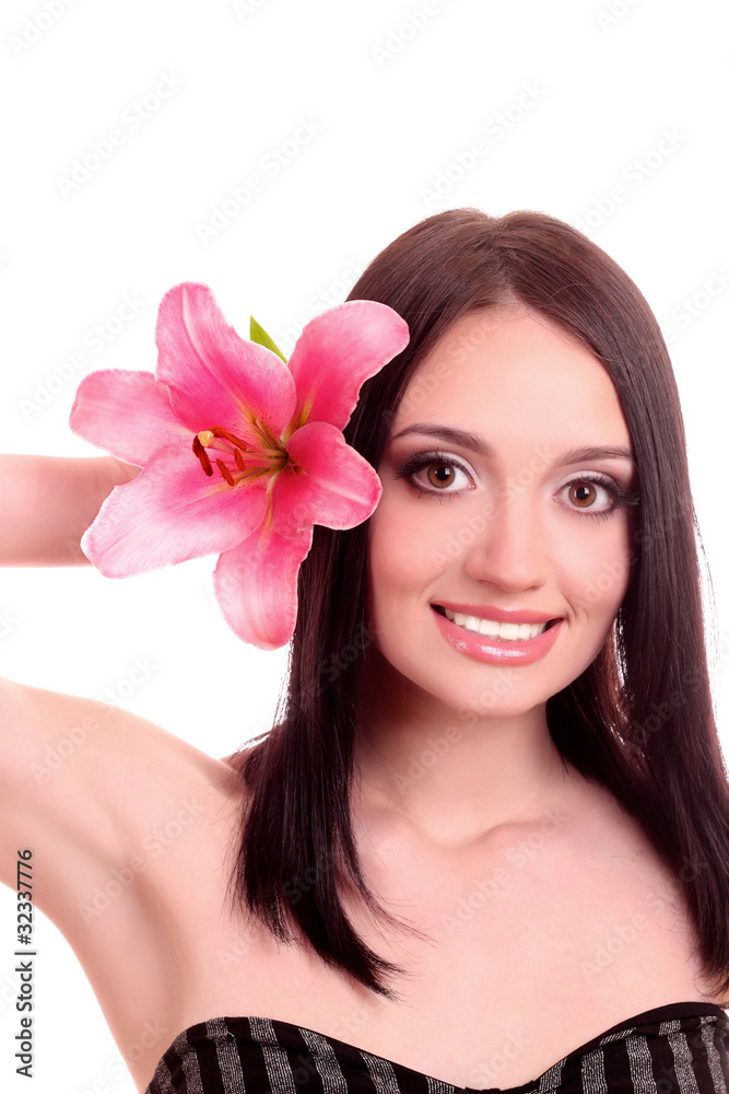 Beautiful young woman with lily flower