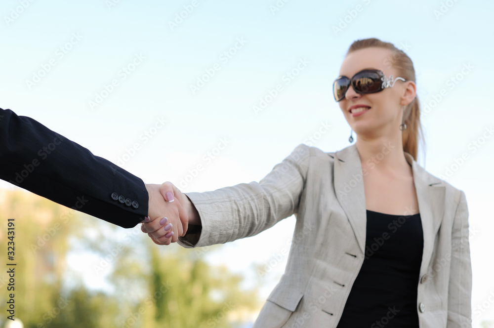 shaking hands on a light background shaking hands on a light background