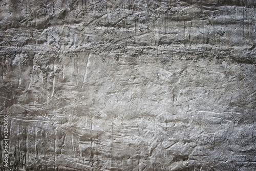 Grungy white limestone wall with scratches and light falloff