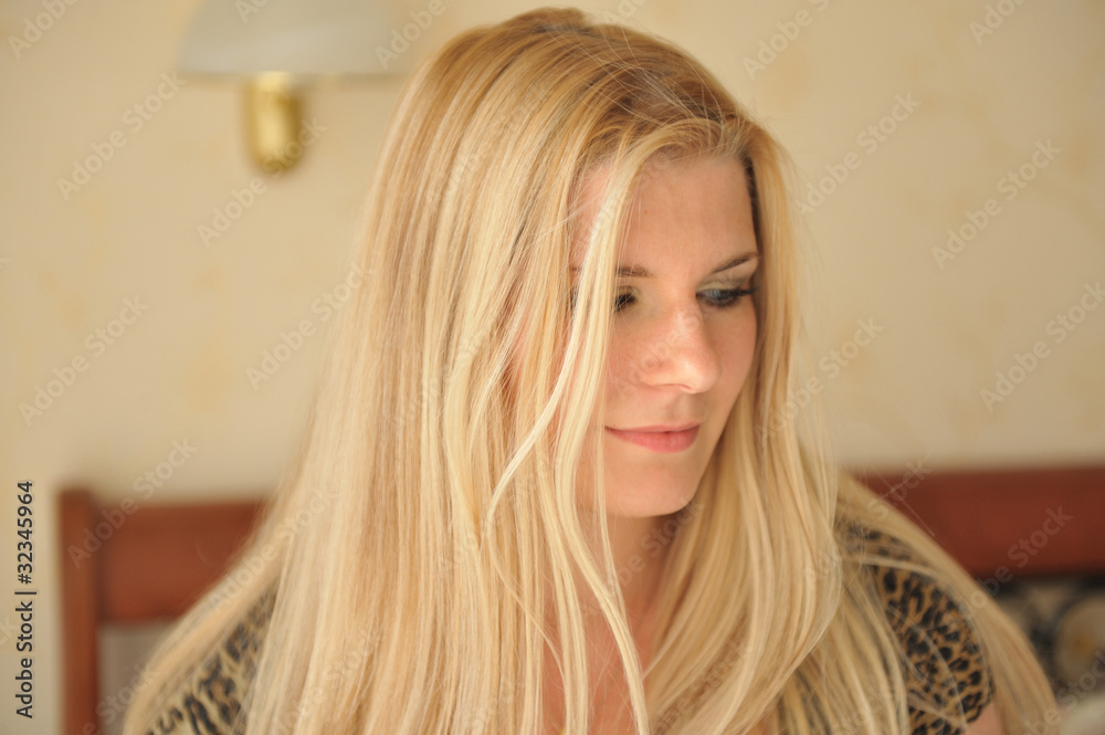 Fototapeta premium Pretty casual smiling woman portrait indoors