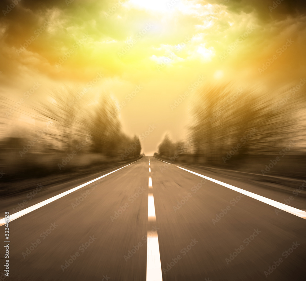 Blurred Road with blurred sky and sunset