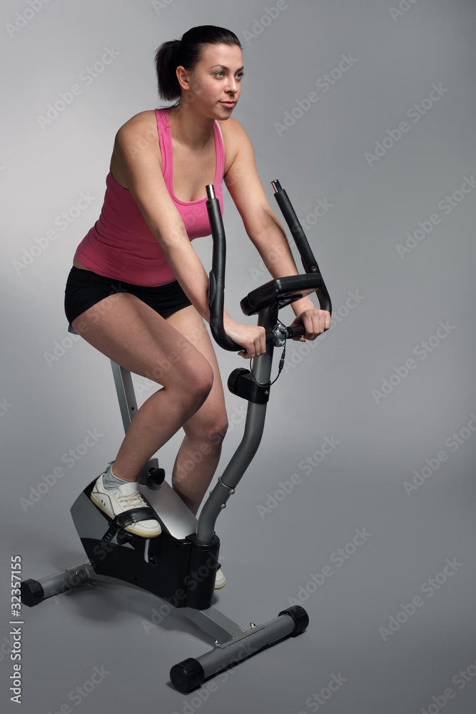 Fototapeta premium beauty girl on bicycle exercise