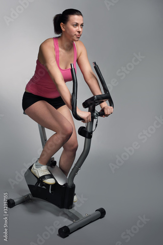 beauty girl on bicycle exercise