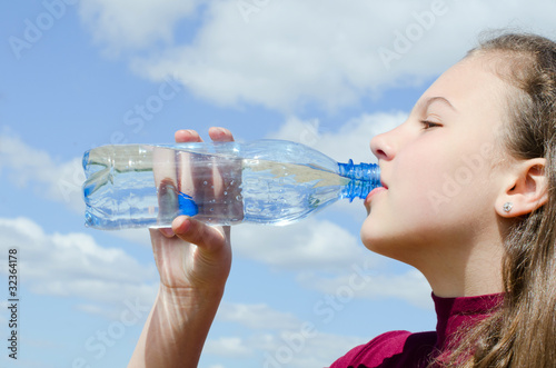 The girl drinks water