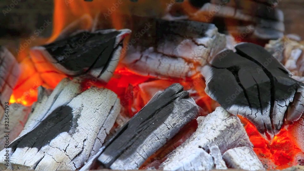 closeup of charcoal burning in the barbecue closeup of charcoal burning in the barbecue