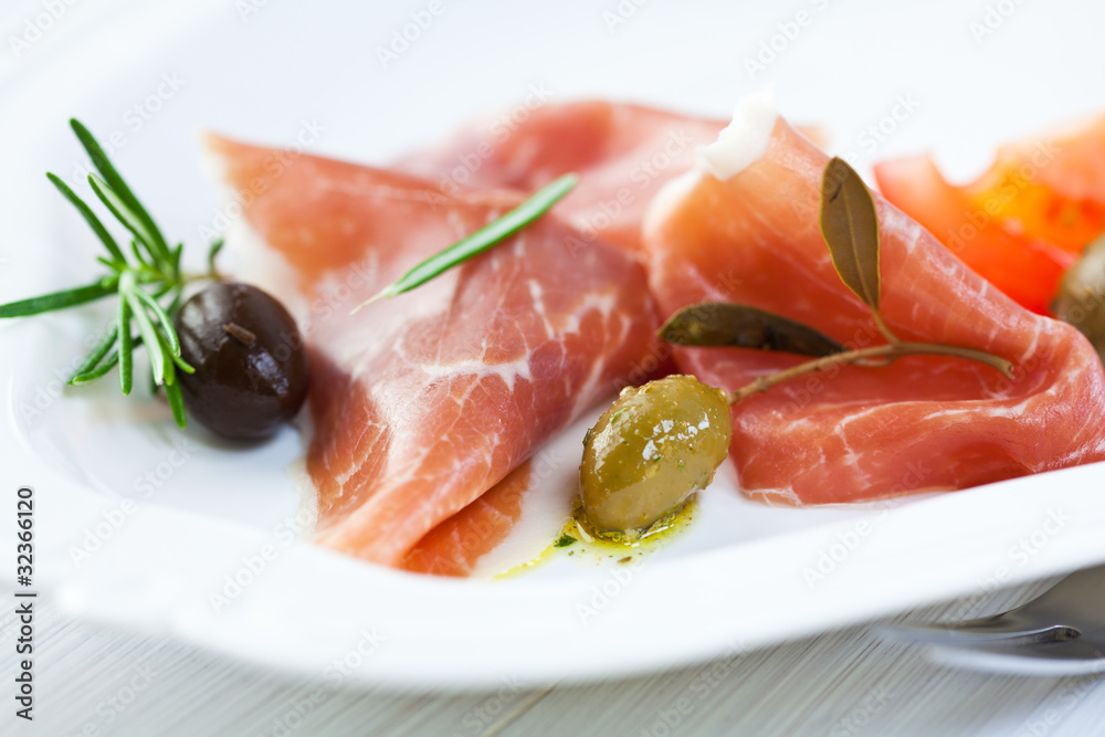 Serrano ham with marinated olives