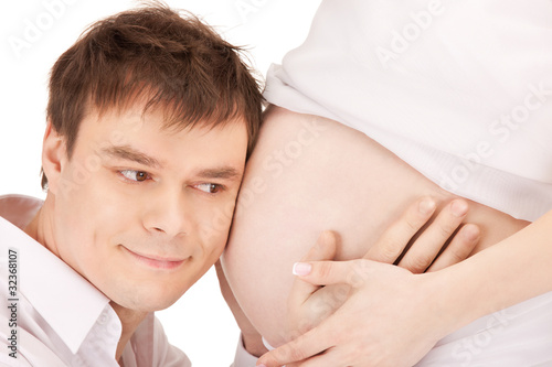 male face and pregnant woman belly