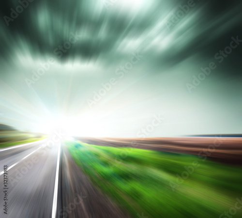 Blurred Road with blurred sky with sun © grthirteen