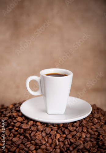 white cup and coffee beans