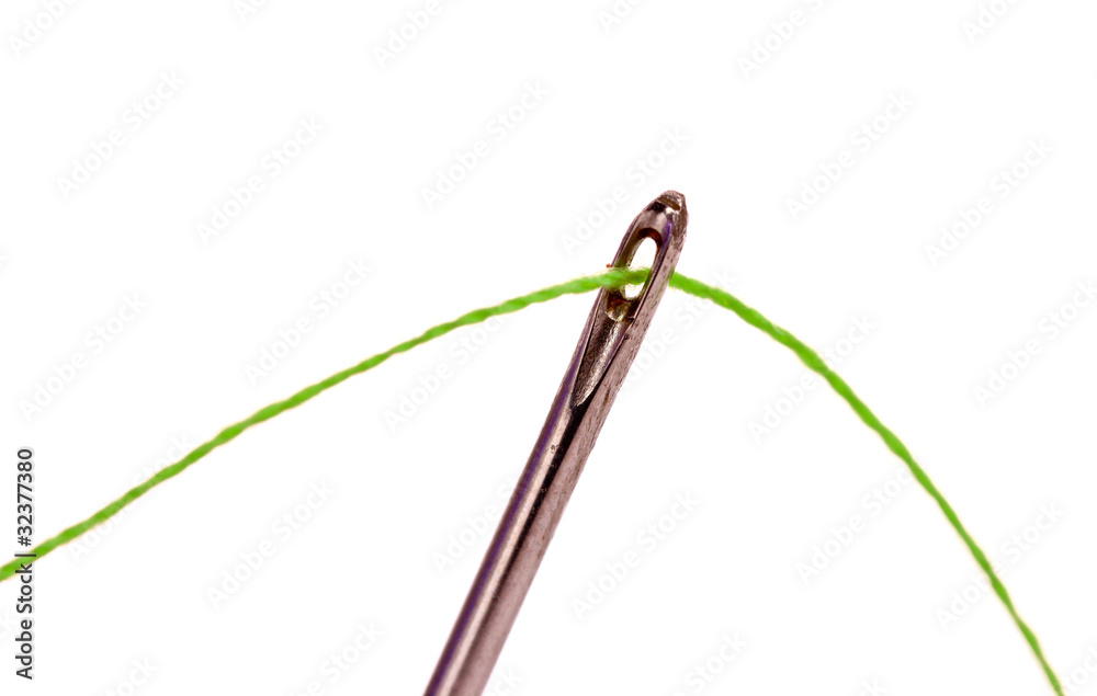 Needle with thread isolated on white