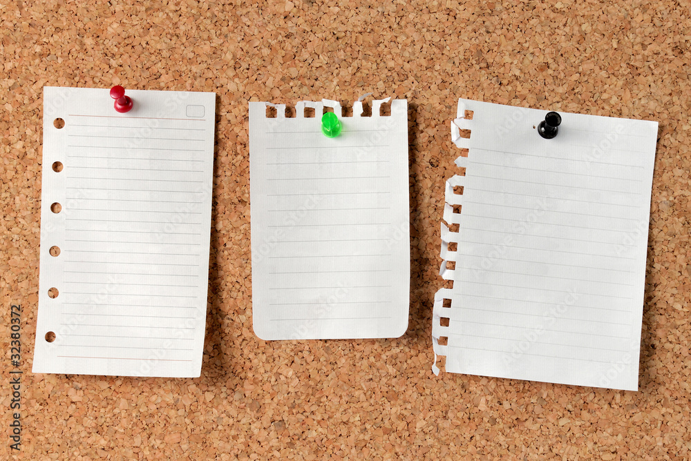 white paper notes on Cork Board white paper notes on Cork Board