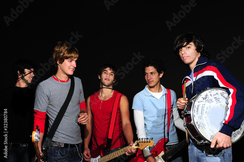 Fotografie Young band posing with instruments