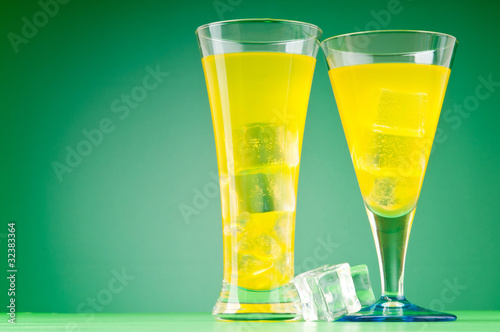 Colourful cocktail in glasses with ice