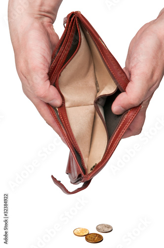 Open an empty wallet in hands and some coins spilled