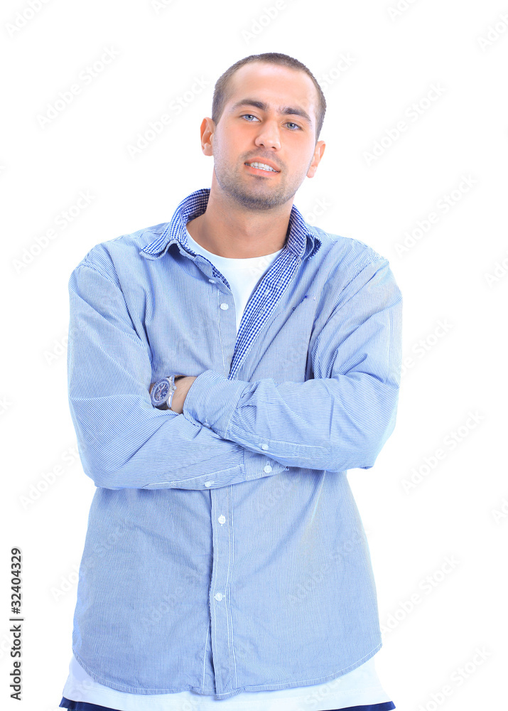 Young man standing with hands in pockets