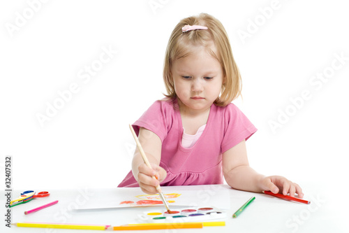 Little girl painting with brush isolated