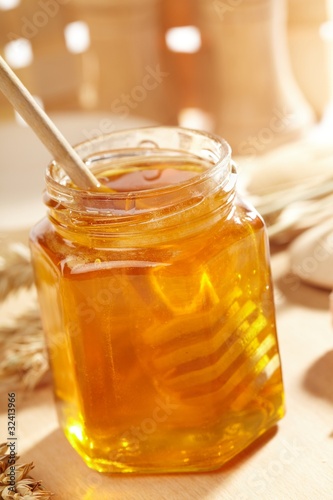 Honey with wood stick