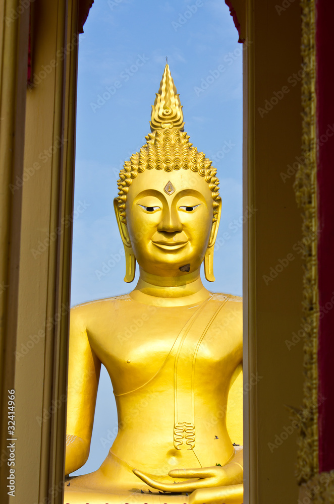 Large golden Buddha. In a temple in Thailand.