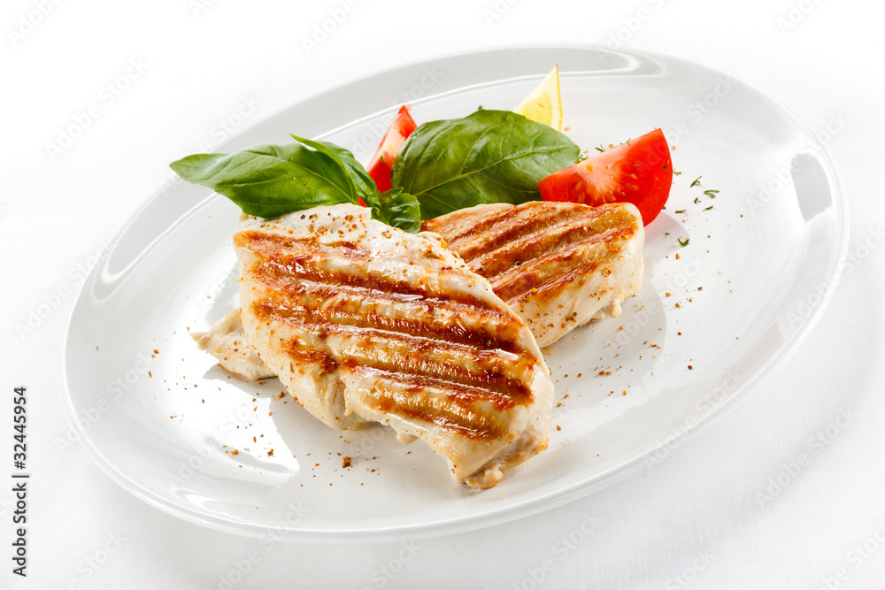 Grilled chicken breasts and vegetables