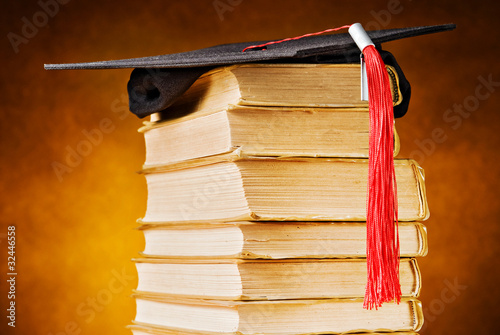 Graduation cap and books