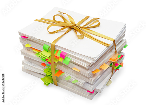 Pack of documents tied up by a gold ribbon