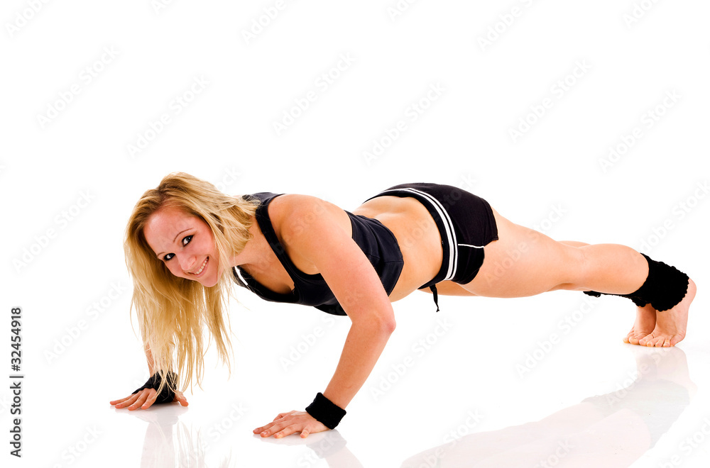 Young attractive Caucasian fitness woman doing gymnastics Young attractive Caucasian fitness woman doing gymnastics