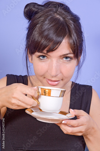 Portrait of beautiful girl drinking coffee