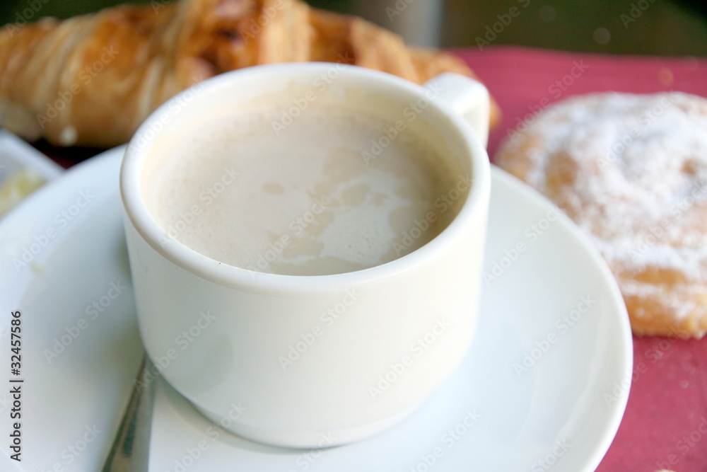 Coffee with croissant and ensaimada pastry from Spain Coffee with croissant and ensaimada pastry from Spain
