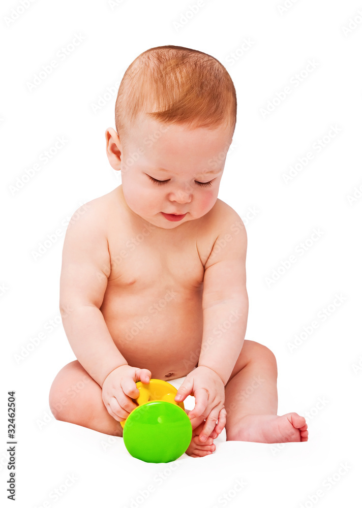 Small baby with toy on the white Small baby with toy on the white