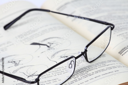 Eyeglass and Old Book