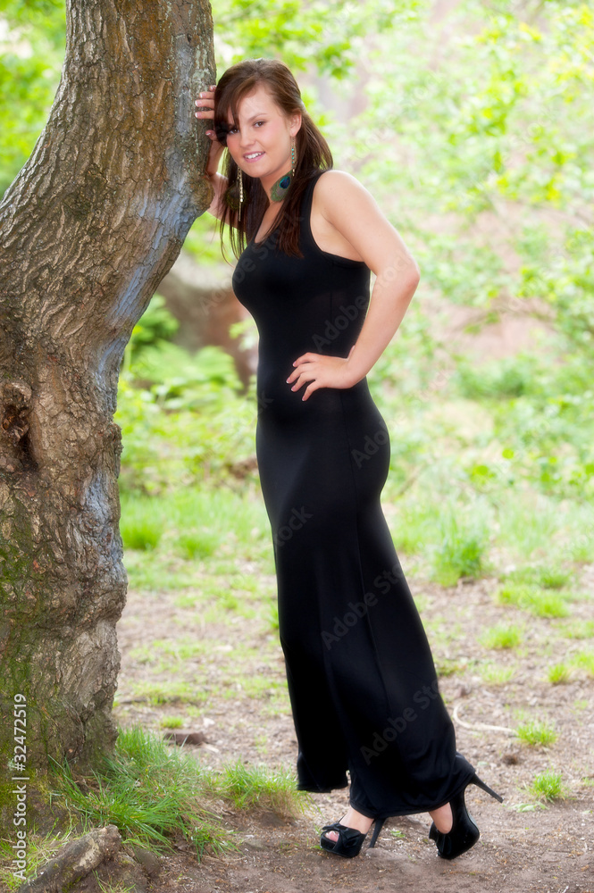 Beautiful female outdoors in black dress Beautiful female outdoors in black dress