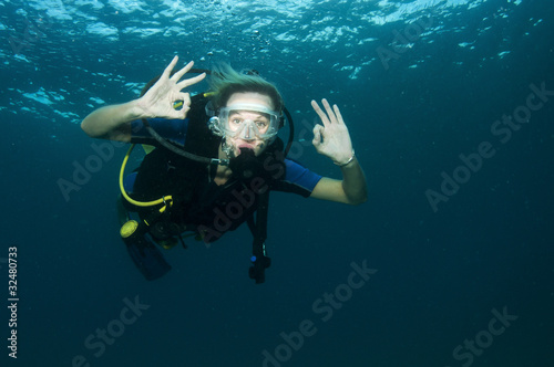 scuba diver makes OK sign